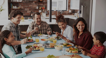 Family enjoying a healthy meal together around a table.