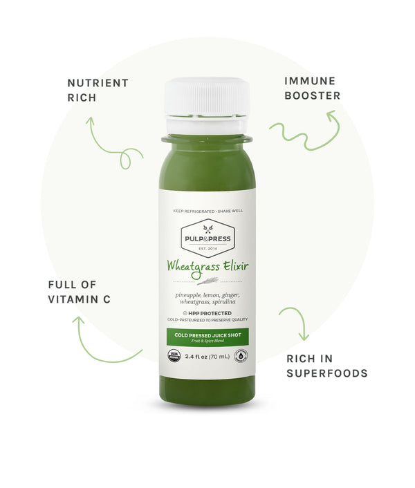 Bottle of wheatgrass elixir. Nutrient rich. Immune booster. Full of vitamin c. Rich in superfoods.