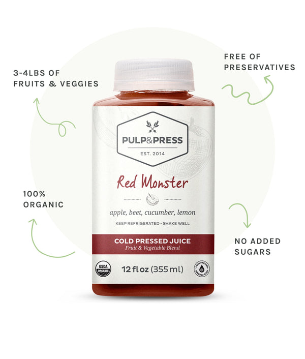 Bottle of red monster juice. 3 to 4 pounds of fruits and veggies. Free of preservatives. 100% organic. No added sugars