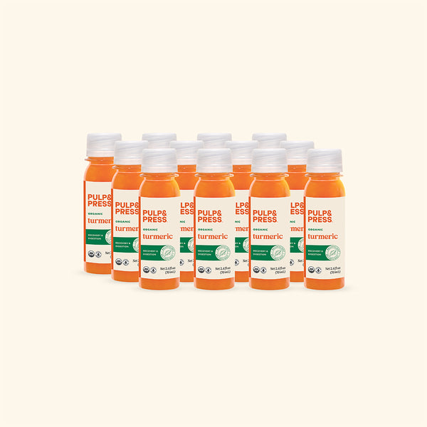 Multiple bottles of Pulp & Press Turmeric juice on a white background