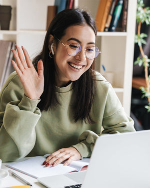 Woman offering support on a laptop